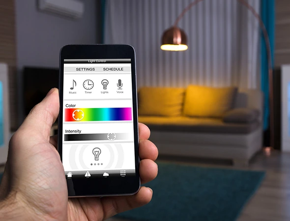 ChatGPT said: User controlling LED lighting system on mobile phone, customizing colors and shades for personalized ambiance.